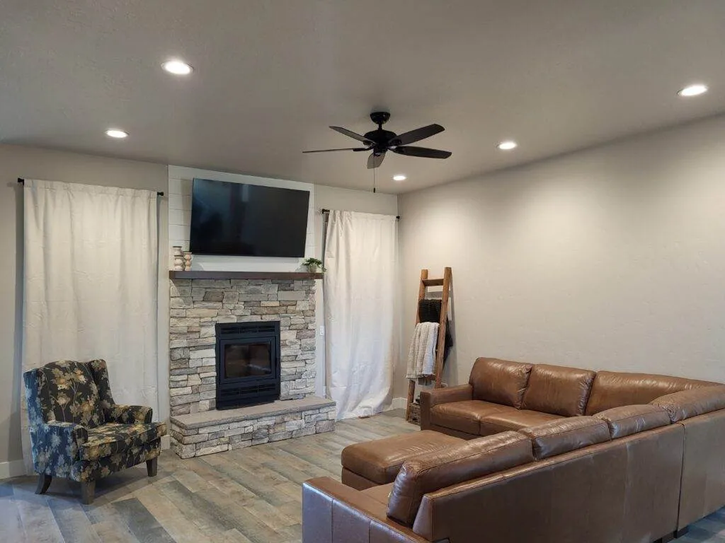 a living room with a fireplace and a couch