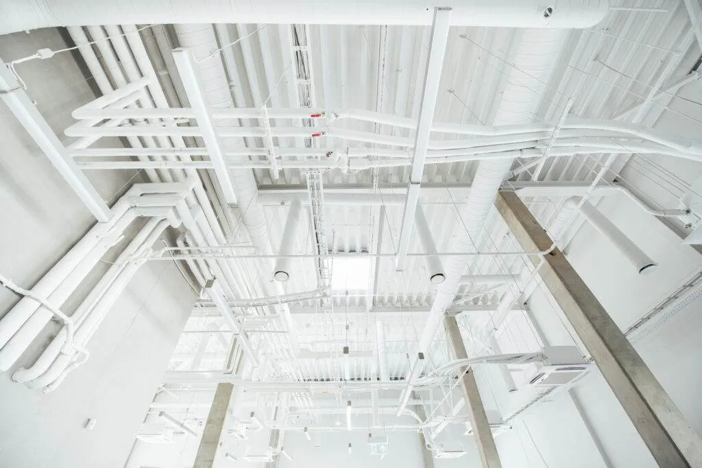 a white pipes and pipes in a building