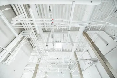 a white pipes and pipes in a building